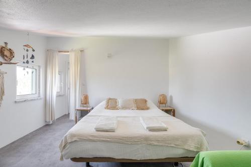 Postel nebo postele na pokoji v ubytování Comporta Hideaway Amazing Views Desert Beaches