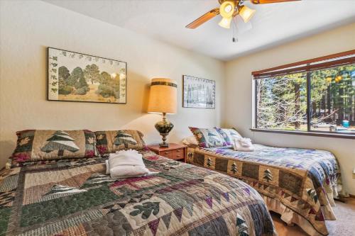 a bedroom with two beds and a window at Minutes From Heavenly Valley Lake Tahoe Beaches in South Lake Tahoe