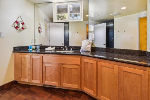 a large kitchen with a sink and a mirror at Private Beach, Close To Everything in South Lake Tahoe