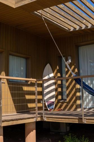 a surfboard sitting on the porch of a house at Radisson Blu Resort Taghazout Bay Surf Village in Taghazout