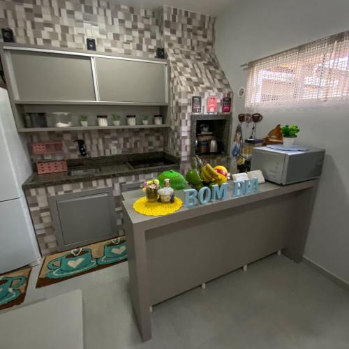 a model of a kitchen with a counter top at Pousada Rota dos Mares in Penha