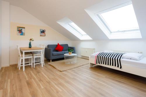 Postel nebo postele na pokoji v ubytování FullHouse Premium Apartments AB5 Halle
