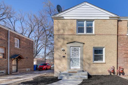 a brick house with a white door on a street at 2 Mi to Calumet Park and Beach Windy City Escape! in Chicago