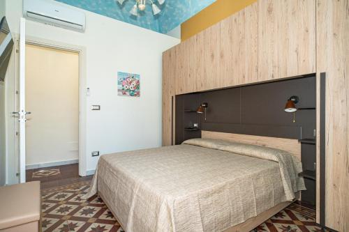 Ένα ή περισσότερα κρεβάτια σε δωμάτιο στο Casa Ciumifriddu