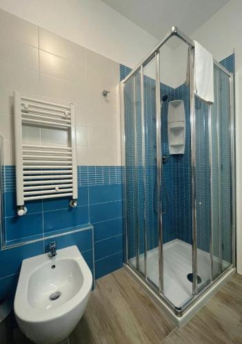 a bathroom with a sink and a shower and a toilet at Sake' Beach in Senigallia