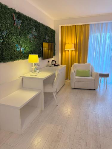 a living room with a white desk and a chair at Krystal Boutique Mansion in Hunedoara