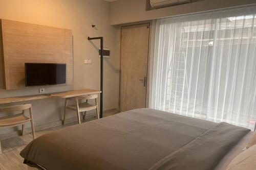 Katil atau katil-katil dalam bilik di Gemini Star Hotel Kuta