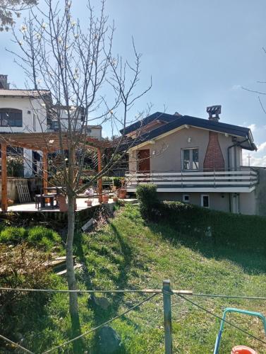 a house sitting on top of a lush green yard at NiFe Tiny House - Secret Garden in Montalbo