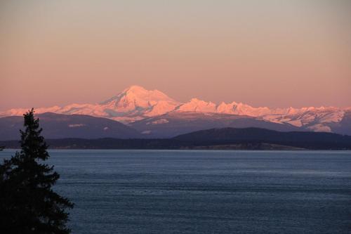 a view of a mountain range with snow covered mountains at TideAway Farm on Private Island! Escape & Indulge Mother Nature! in Anacortes