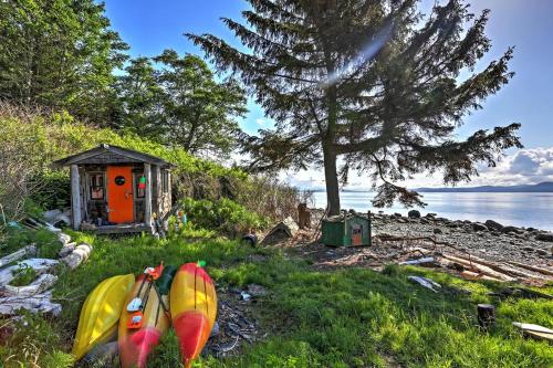 a group of kayaks sitting in the grass next to a house at TideAway Farm on Private Island! Escape & Indulge Mother Nature! in Anacortes