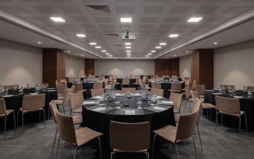 a large room with tables and chairs in it at Radisson Blu Hotel Ankara Cankaya in Ankara