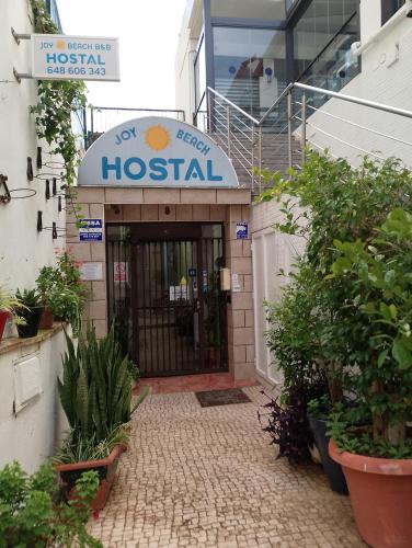 a hospital building with a sign above the door at Joy Beach B&B in Torremolinos