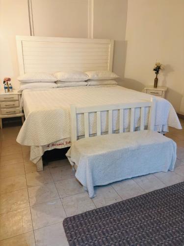 Postel nebo postele na pokoji v ubytování Hotel La Casa Ovalle