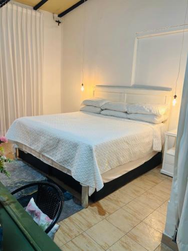 Postel nebo postele na pokoji v ubytování Hotel La Casa Ovalle