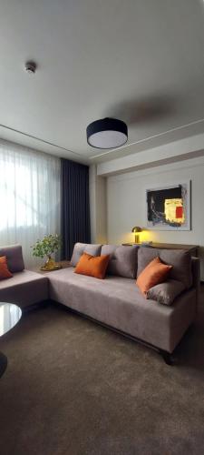 a living room with a couch and a table at Mini Hotel on Brovarskaya in Kyiv