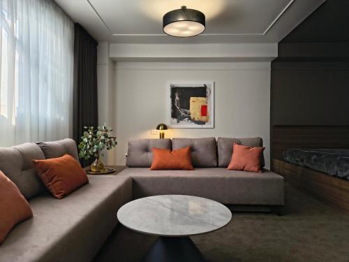 a living room with a couch and a table at Mini Hotel on Brovarskaya in Kyiv