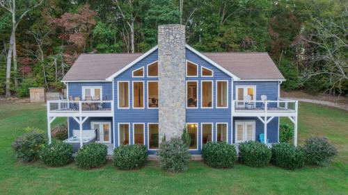 a large blue house with a chimney at Whiskey Way Inn in Candler