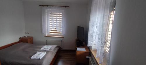 Postel nebo postele na pokoji v ubytování Apartmán AMSEL
