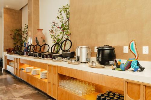 a long counter with a bunch of items on it at Camino Real Zaashila Huatulco in Santa Cruz Huatulco