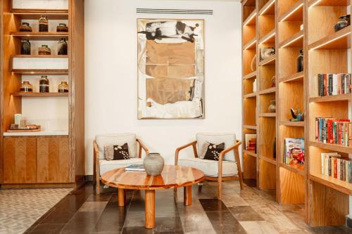 a living room with a table and two chairs at Camino Real Zaashila Huatulco in Santa Cruz Huatulco