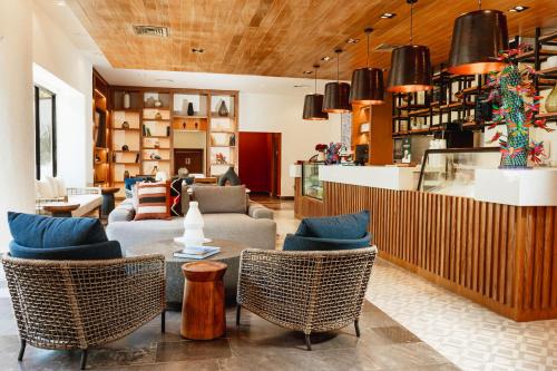 a lobby with couches and chairs in a store at Camino Real Zaashila Huatulco in Santa Cruz Huatulco