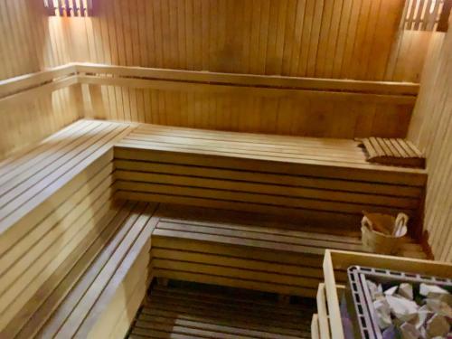 an empty sauna with wooden floors at Boho Beach Apartment in Tatlisu