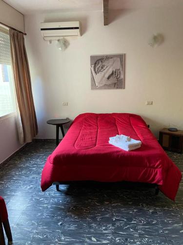 Postel nebo postele na pokoji v ubytování La Casita Yogui