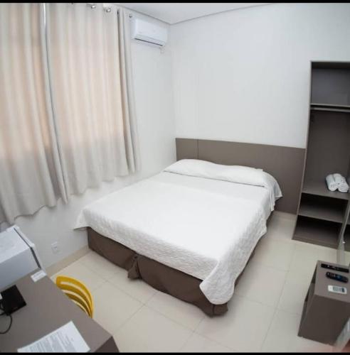 Ένα ή περισσότερα κρεβάτια σε δωμάτιο στο Hotel Jenipapo