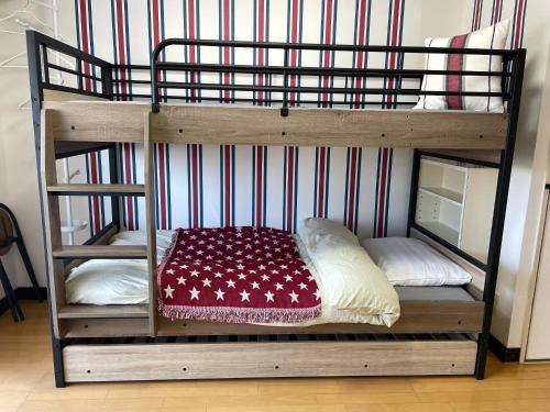 a couple of bunk beds with pillows on them at YS Minami Miyazaki No, 901 - Vacation STAY 18876 in Miyazaki