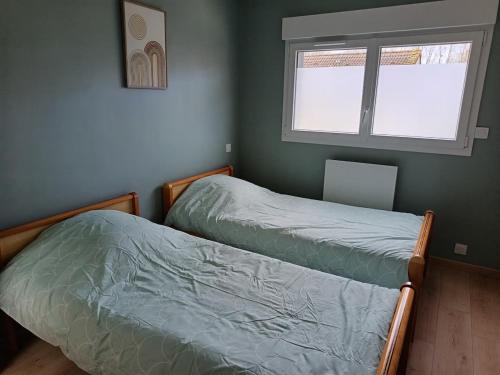 Postel nebo postele na pokoji v ubytování Gîte Axel'Air