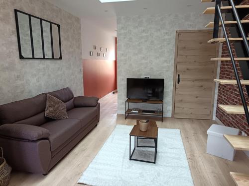 TV a/nebo společenská místnost v ubytování Gîte Axel'Air
