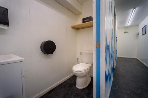 a bathroom with a toilet and a sink at Red River Elusive Elk Glamping Tent 1 in Stanton
