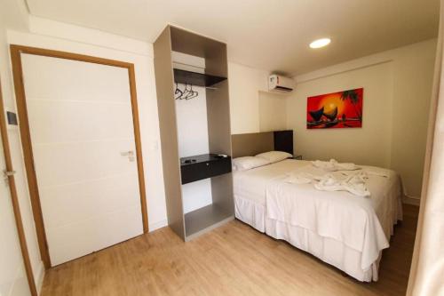 Ένα ή περισσότερα κρεβάτια σε δωμάτιο στο Easy Suites Natal Hotel