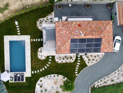 an aerial view of a house with a solar panel at Villa Grassi with private pool Nizza Monferrato in Calamandrana