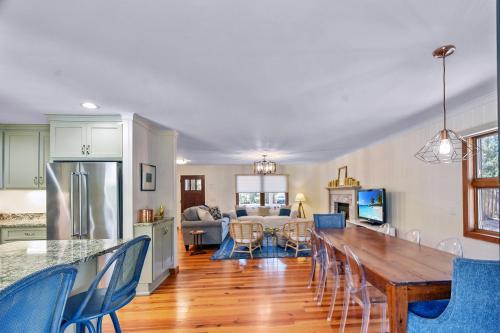 a kitchen and living room with a table and chairs at Privacy Please! in Saint Simons Island