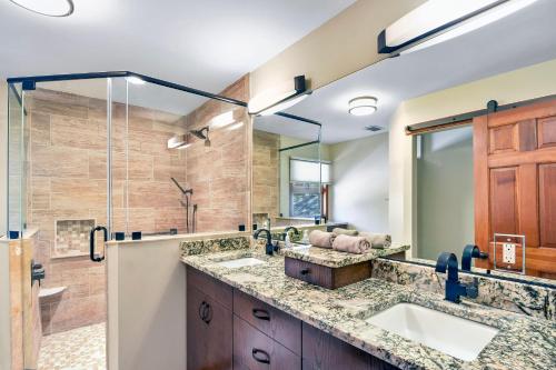 a bathroom with two sinks and a shower at Privacy Please! in Saint Simons Island