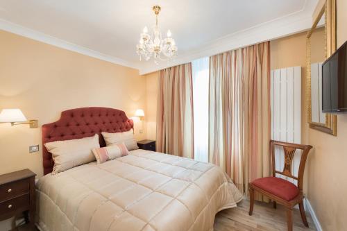 Ένα ή περισσότερα κρεβάτια σε δωμάτιο στο London Residence