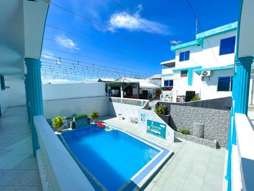 a swimming pool on the balcony of a house at HOSTAL PIAZZOLLA in Manta
