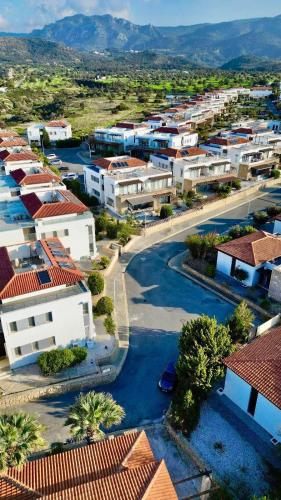 an aerial view of a city with buildings and water at Boho Bay Apartment in Akanthou
