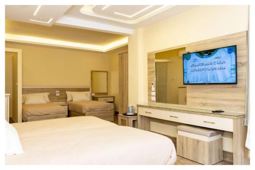 Hassan Pyramids Hotel&Rooftopにあるベッド