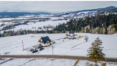 an aerial view of a house in the snow at Aleksandrówka in Szlembark