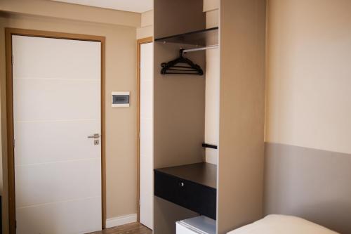 Ένα ή περισσότερα κρεβάτια σε δωμάτιο στο Easy Suites Natal Hotel