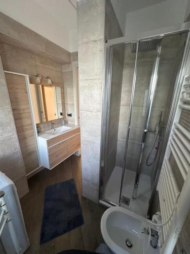 a bathroom with a shower and a sink and a toilet at Sanremo Class New in Sanremo