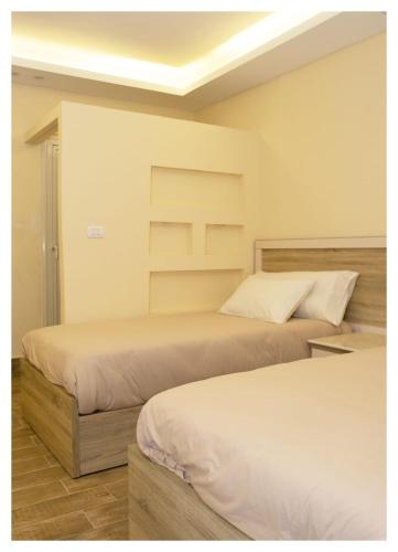 Hassan Pyramids Hotel&Rooftopにあるベッド