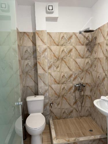 a bathroom with a toilet and a sink at Villa Athina BC in Serres