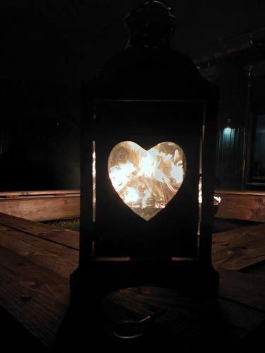 a heart in a lantern in the dark at Happy-Nest in Oberkrämer