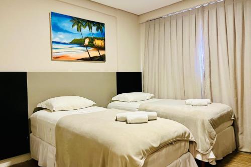 Ένα ή περισσότερα κρεβάτια σε δωμάτιο στο Easy Suites Natal Hotel
