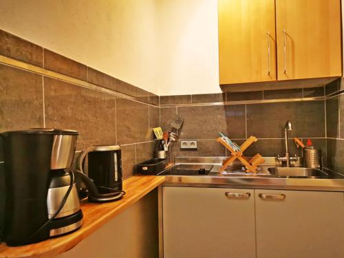 a kitchen with a coffee maker on a counter at Studio Brennerei Haselberg in Wriezen