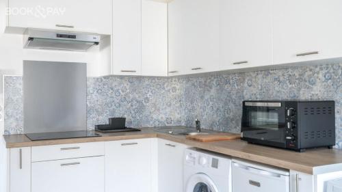 Kuchyň nebo kuchyňský kout v ubytování Appartement Tain L'Hermitage
