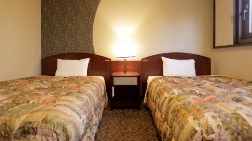 Ένα ή περισσότερα κρεβάτια σε δωμάτιο στο Tokyo Inn - Vacation STAY 26584v